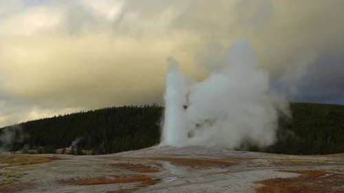 Geyser Erupts and Emits Steam in Nature