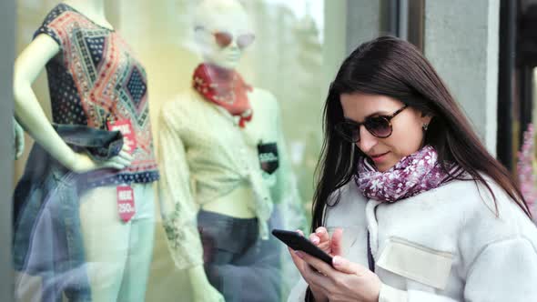 Cover for Stylish Shopper Woman Taking Photo of Dummy in Showcase of Shop Fashion Clothes Using Smartphone