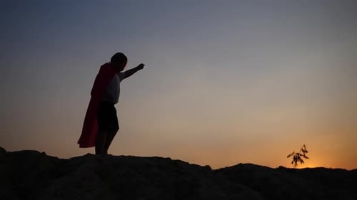 superhero boy running on the field