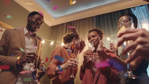 Friends Celebrating Together at Festive Indoor Party