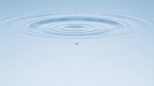 Water Droplets Rippling Light Blue Water