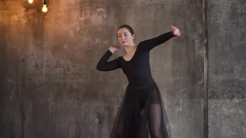 Female Dancer in Black Leotard Dancing Gracefully
