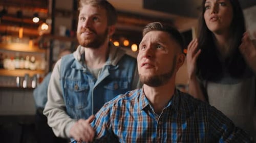 Friends Celebrate Win at Indoor Sports Bar