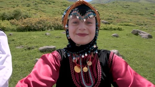 Smiling Young Adult in Traditional Dress Outdoors