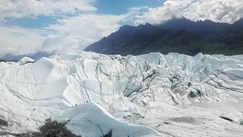 Iced Ridges with Black Ash Melting Ice From Global Warming Science Alaska USA
