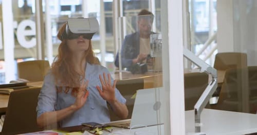 Woman Using VR Headset in Modern Office
