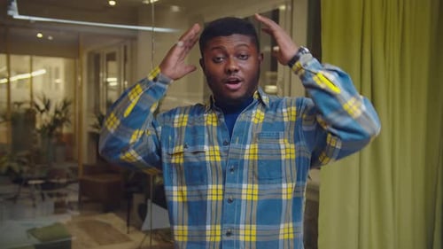 Young Adult Hands on Head Expression