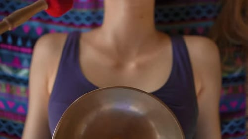 Woman Relaxing with Sound Bowl Meditation