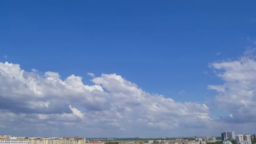 Daytime Clouds Over a Sunny Summer Town