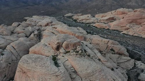 Desert Rock Formations and Mountain Landscape Aerial View