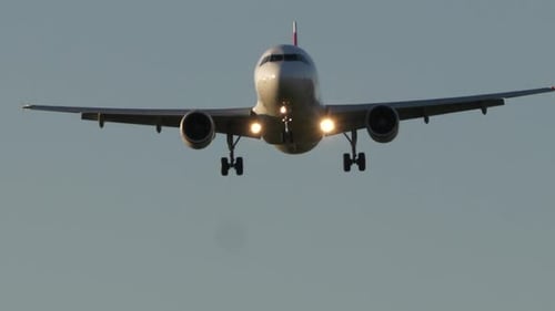 Commercial Airplane Airliner Landing at Airport Terminal