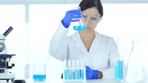 Woman Scientist Conducting Research in Bright Laboratory
