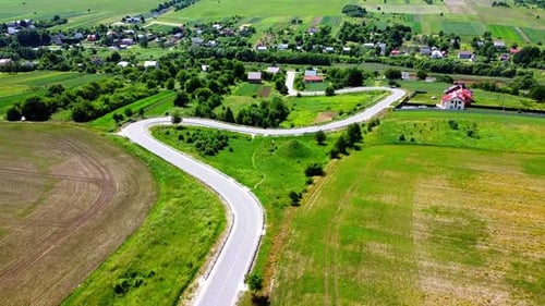 Aerial drone view of a flying over the rural agricultural landscape.