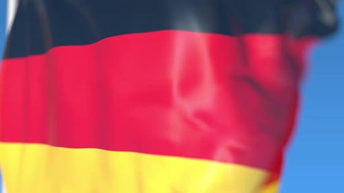 German Flag Waving Seamlessly Against Blue Sky