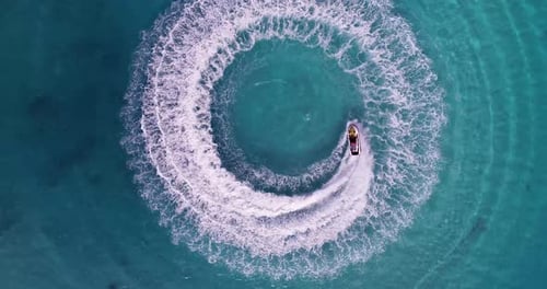 Jet skiing in circles in the Indian ocean. Powerful jet ski. Medium shot