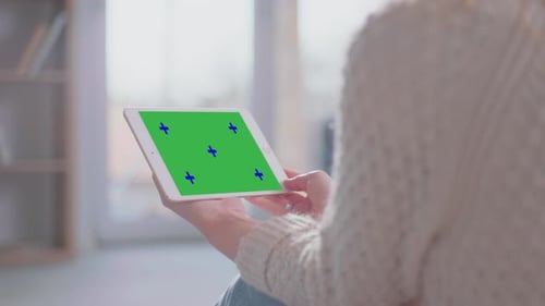 Woman Uses Tablet with Green Screen at Home