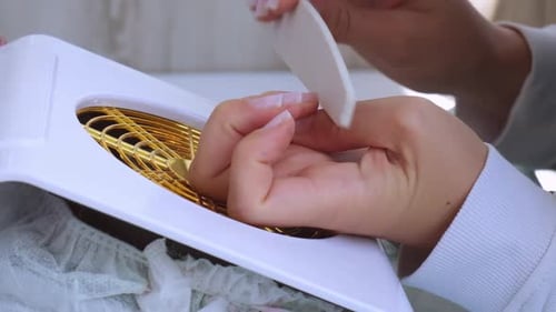 Woman Filing Nails Close Up