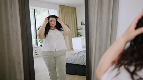 Woman Posing in Mirror Inside Home Bedroom