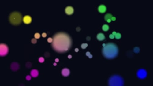 Animation de points lumineux multicolores se déplaçant dans un mouvement hypnotique sur fond noir