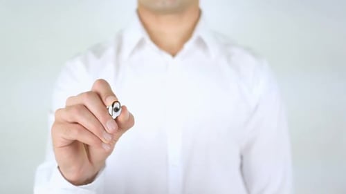Man Writes Blogging on Clear Surface with Marker