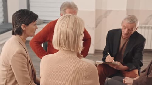 Adults in Group Therapy and Support Session