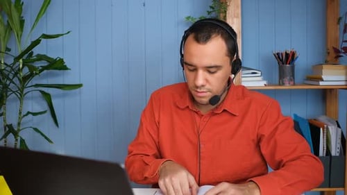 Young Adult Working at Computer in Home Office