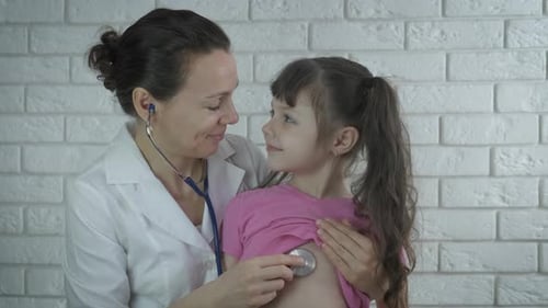 Pediatrician with a child.