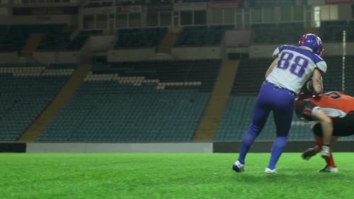 Footage in Slowmotion of American Football Player on Stadium Running on Another Sportsman Than
