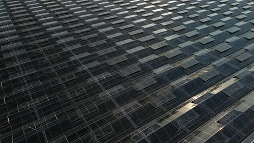 Greenhouses at sunset from a bird's-eye view