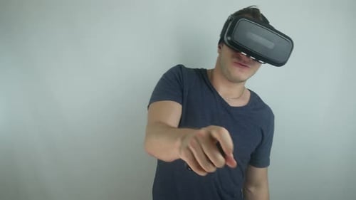 Man Using Virtual Reality Headset with Controller