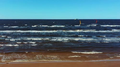 Aerial Shot of Kiteboarders and Kitesurfers of the Baltic Sea Latvia