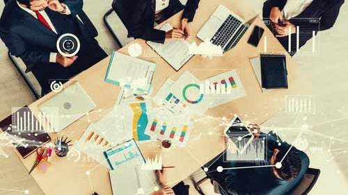 Team Meeting in Modern Office with Data Graphics