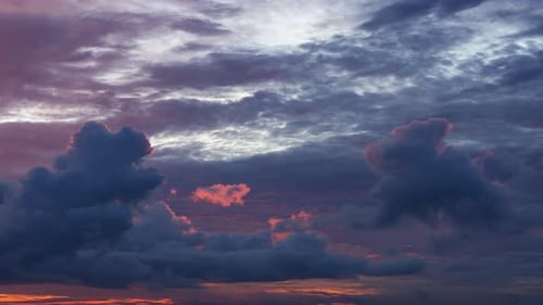 Dramatic Clouds Billow in a Colorful Sky Time-Lapse