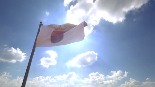Realistic Waving Flag with Coat of Arms Against Blue Sky