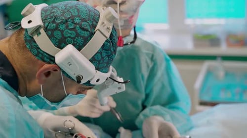 Doctors' faces during surgery.