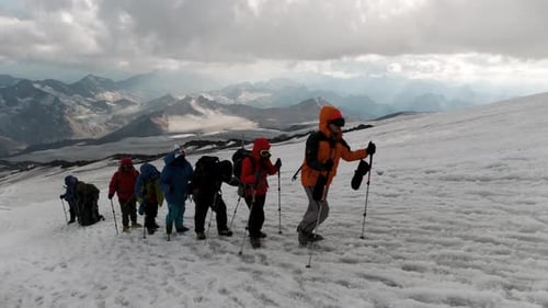 Concept of extreme sport and hobbies, climbers on the background of mountain range