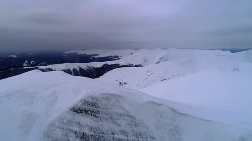 Aerial View of Snow Covered Mountain Range