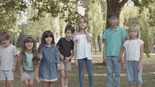 Group of Children Standing in a Park Together