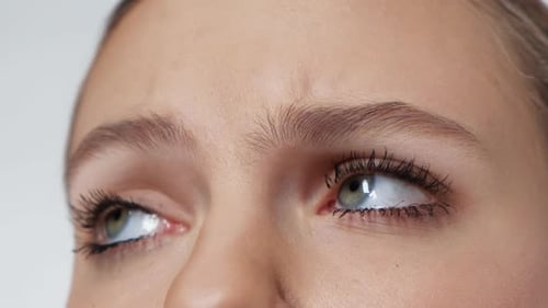Close Up of Woman's Expressive Eyes Looking Around