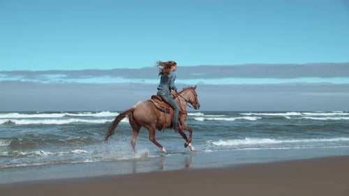 Super slow motion shot of woman riding horses at beach, Oregon, shot on Phantom Flex 4K