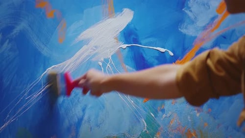 Artist Painting Abstract Art on Canvas with Brush