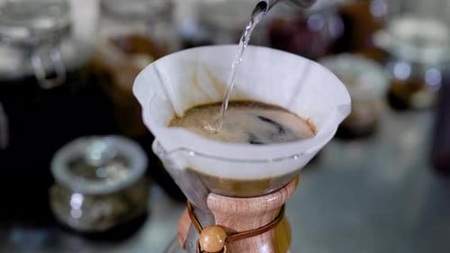 Water Pouring into Coffee Filter in Coffee Maker
