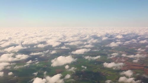 Aerial view of countryside and cloudscape from window seat