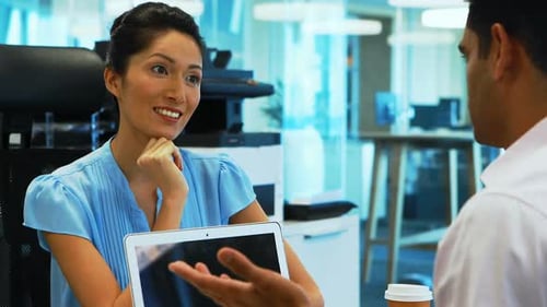 Colleagues Discuss Business in Modern Office Space