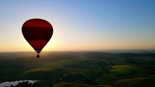 Hot Air Balloons Soaring Over Lush Green Landscape