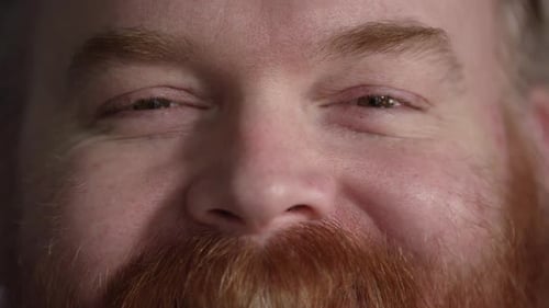 Extreme Close Up of Man's Face with Ginger Beard