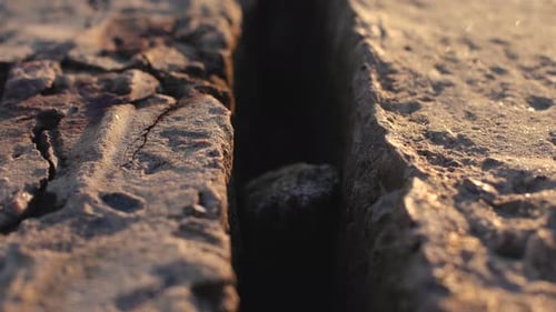 Abstract Dolly Shot of Stone Concrete Slabs on the Beach