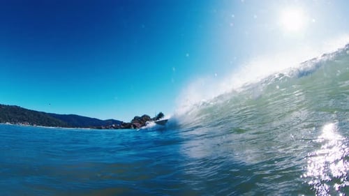 Ocean Wave Breaks on the Shore in Brazil at Sunny Day