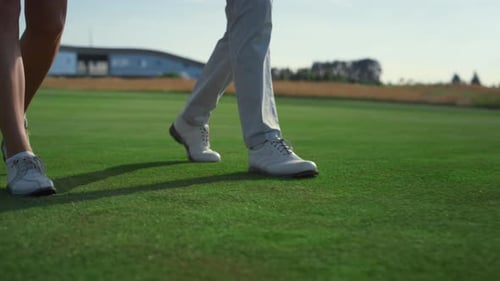 Golf Couple Legs Going Walk on Course Grass
