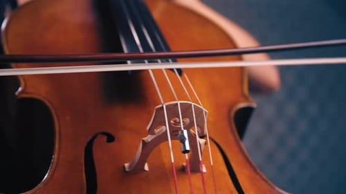Close Up of Cello Being Played With Bow